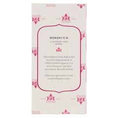 Harney & Sons Hibiscus Tea hot cup—rich crimson hue with tart floral notes.