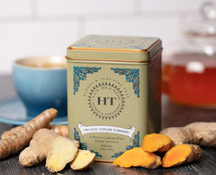 Harney and Sons HT Organic Ginger Turmeric Tea cup showing warm ruby brew