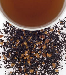 Harney and Sons Hot Cinnamon Spice tea tin and cup, inviting aromatic, comforting moments.