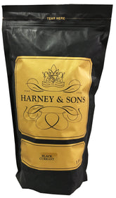 Harney & Sons loose leaf black currant tea in a cup, full-bodied berry flavor for hot or iced.