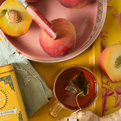 Harney and Sons Peaches and Ginger tea cup sip, inviting fruity aroma and ginger zing at home