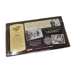 Hawaiian Host AlohaMacs milk chocolate coating glistening over roasted macadamias.
