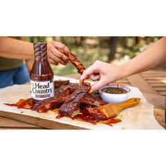 Head Country Sweet & Sticky sauce on grill for finishing touches.