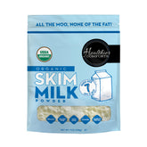 Healthier Comforts organic skim milk powder bottle pour showing shelf-stable dairy for smoothies and coffee