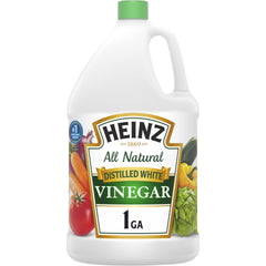 Heinz all-natural distilled white vinegar being poured from a 1 gal jug to brighten marinades