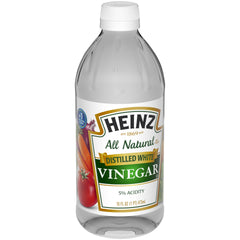 Close-up of clear HEINZ vinegar showing clean finish for dressings