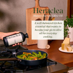 Heraclea Mature Harvest bottle pour highlights smooth, versatile olive oil for meals