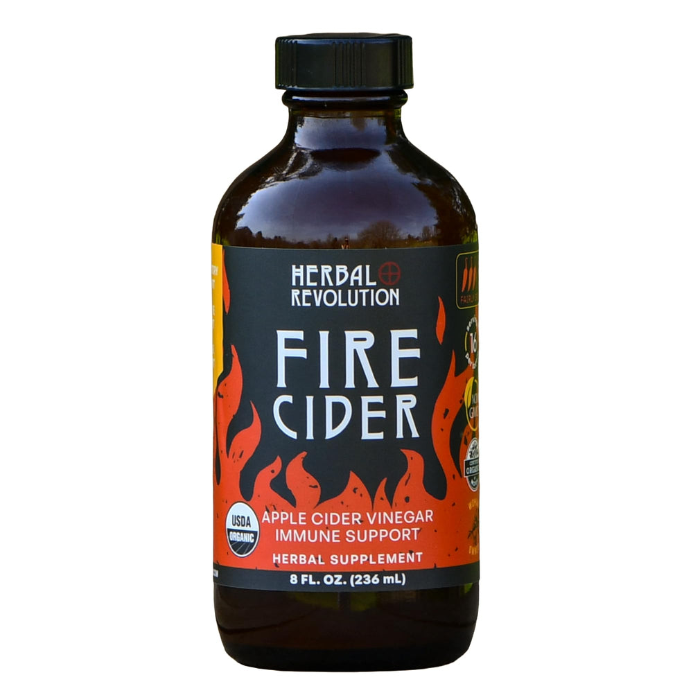 Herbal Revolution Fire Cider bottle label close-up highlighting organic ingredients for bold flavor.