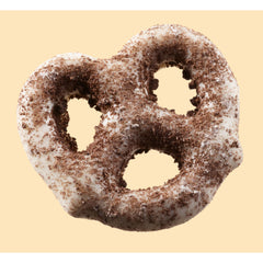Hershey's Cookies 'n' Creme Dipped Pretzels cookie bits detail, adds crunchy sweetness.