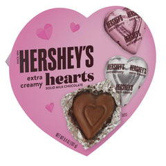 Close-up of Hershey's Extra Creamy Milk Chocolate Hearts showing smooth texture.