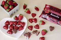 HERSHEY'S extra creamy milk chocolate hearts arranged for a party candy table.