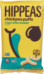 Close-up of HIPPEAS vegan white cheddar puffs showing crunchy texture