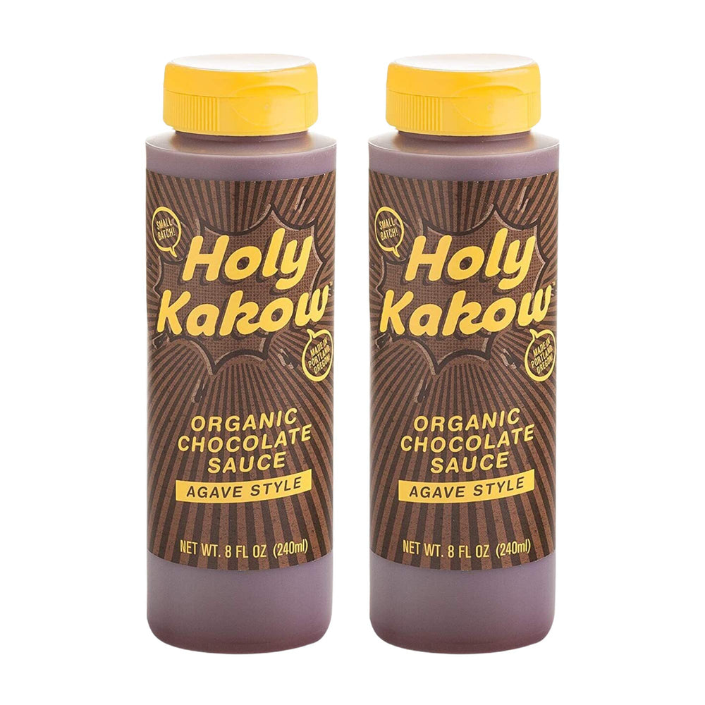 Holy Kakow Organic Chocolate Sauce bottle pouring over dessert for rich, gluten-free indulgence