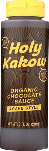Holy Kakow Organic Chocolate Sauce bottle on the counter, perfect dessert topping.