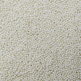 Homankit white nonpareil sprinkles bottle for even cake decorating and eye-catching toppings.