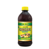 Home Choice Jamaican Ginger Extract bottle pour for bold, natural flavor in drinks