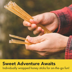 Close-up view of a single-serve Homestead Honey stick for portable use.