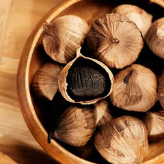 HOMTIEM Black Garlic ready-to-eat snack, inviting bite for quick nourishment.