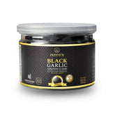 Homtiem Black Garlic whole peeled cloves, ideal for snacking and cooking.