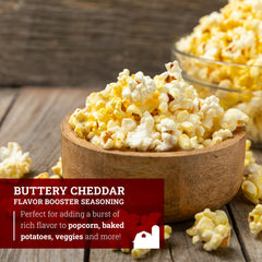 Hoosier Hill Farm seasoning poured over popcorn delivers rich cheddar