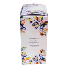 Huckleberry Haven tea tin beside a cup ready to enjoy hot or iced