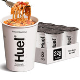 Huel Hot and Savory Cups Spicy Gochujang packaging highlighting convenient plant-based nutrition for busy days.