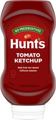 Hunt's Tomato Ketchup as a burger topping to add tangy tomato flavor.