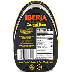 Iberia cooked ham slices on cutting board, ideal for sandwiches and charcuterie.
