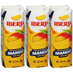 Iberia Mango Nectar bottle on kitchen counter highlights real mango puree for refreshing drinks.