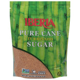 Iberia Pure Cane Turbinado sugar crystals in a jar for premium coffee sweetness.