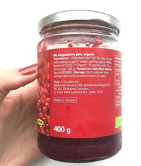 IKEA Food Lingonberry preserves spread on toast with cheese.