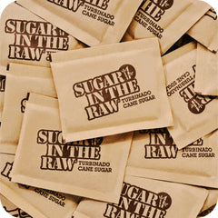 Sugar packets added to coffee for smooth sweetness.
