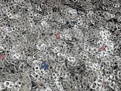 Intotal aluminum pop tabs close-up, ideal for crafts or fundraising projects.