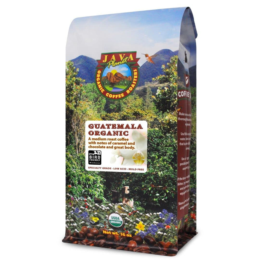Java Planet Low Acid Coffee bag with label and ready-to-grind whole beans.