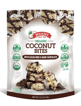 Jennies Coconut Bites close-up showing cacao nibs and coconut for a dairy-free indulgence.