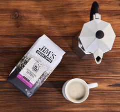 Jim's Organic Coffee label on the bag emphasizes shade-grown, ethically sourced beans