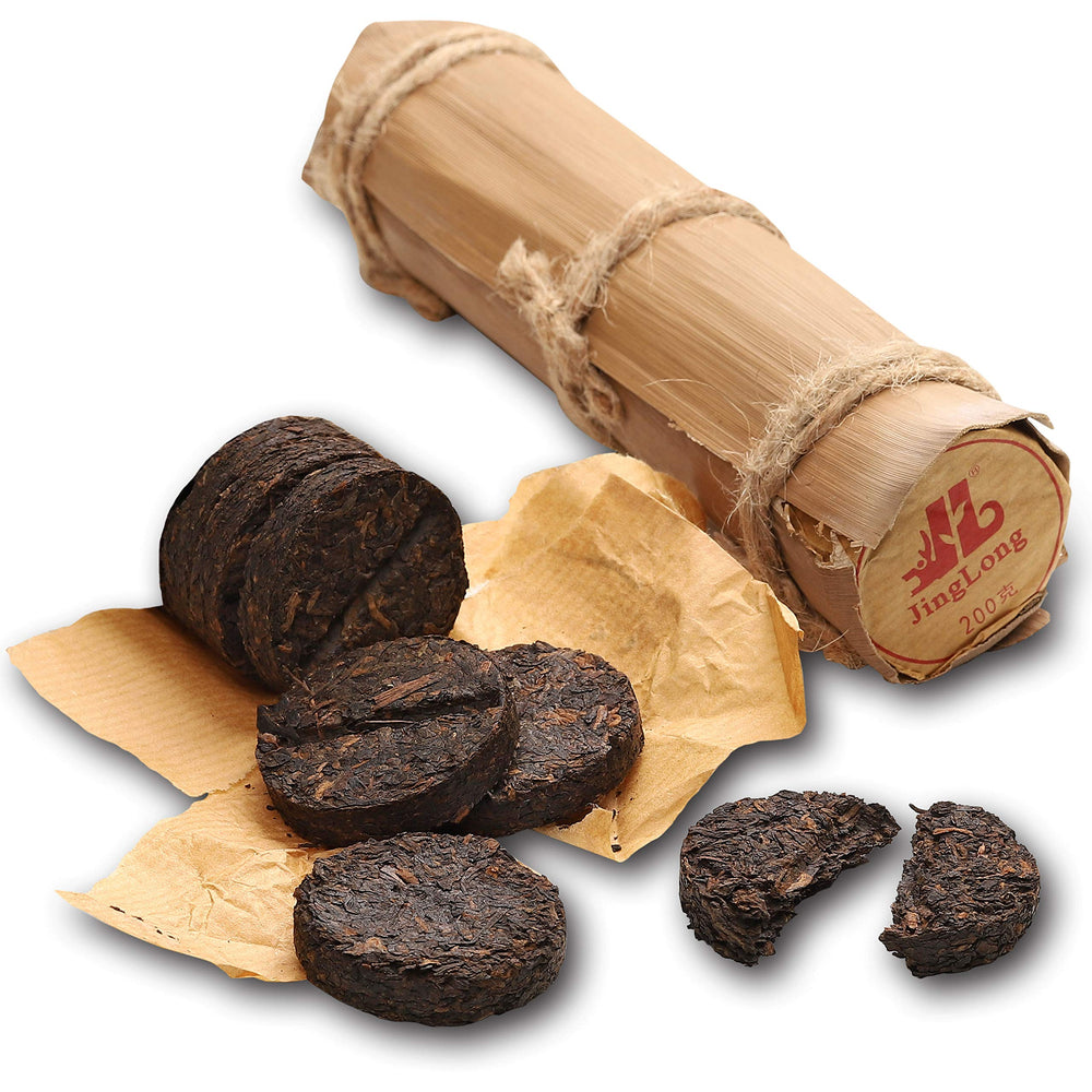 Jinglong Tea Factory Pu-erh tube with bamboo leaves for portable tea.