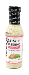 Johnny's Salmon Finishing Sauce bottle pour enhances salmon with creamy dill flavor.