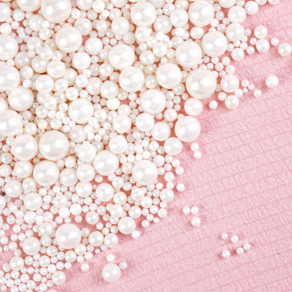 Joyvitas white pearl sugar sprinkles on a cake add a refined decorating touch.