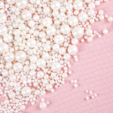 Joyvitas white pearl sugar sprinkles on a cake add a refined decorating touch.