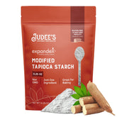 Judee's Expandex tapioca starch powder beside a bag improves baking texture.