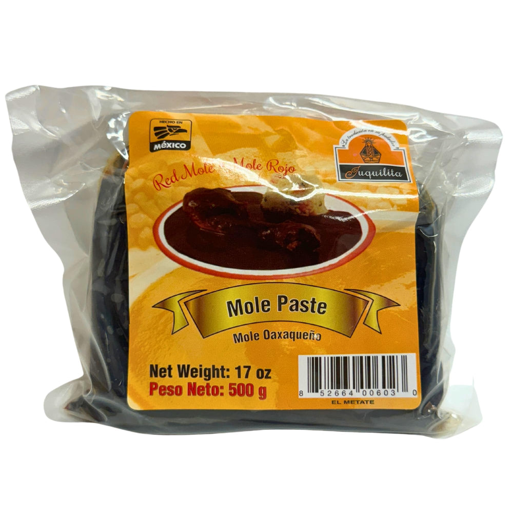 Juquilita Red Mole jar showing glossy sauce, ideal for enriching enchiladas and bowls.