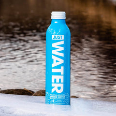 JUST Water label close-up reveals brand and mineral information.