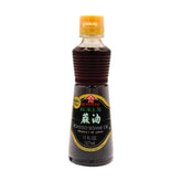 Kadoya Roasted Sesame Oil bottle for marinades and versatile seasoning.