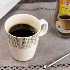 A steaming cup of Kaffree Roma reveals a warming aroma and bold taste.