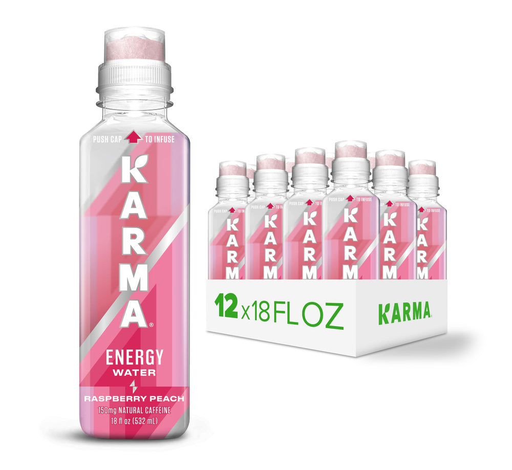 Karma Energy Drink Raspberry Peach bottle on desk for a refreshing pick-me-up