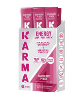 Karma Energy Packets Raspberry Peach dissolving in water for a refreshing lift