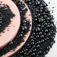 Kasvan Black Pearl Sugar sprinkles on ice cream create striking contrast.