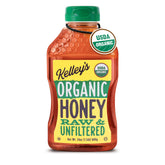 Kelley's organic raw honey bottle pouring into tea for natural sweetness.