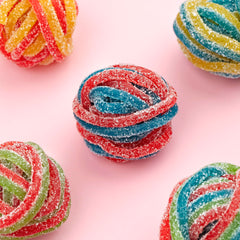 Kervan Bebeto Rainbow Laces displayed at a dessert table for a colorful buffet.